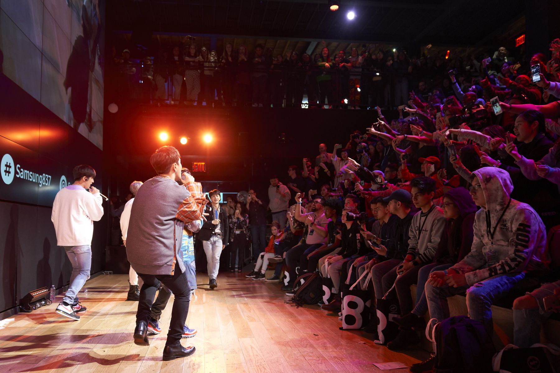 iKON performing on stage for fans at the Samsung Galaxy Level Up event